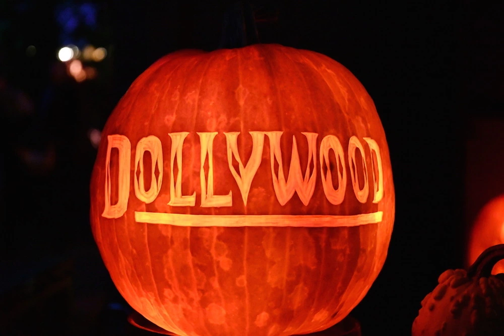 "Dollywood" carved into glowing pumpkin