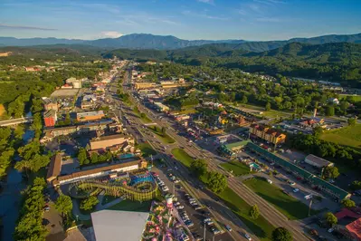 aerial view of the Pigeon Forge Parkway with Smoky Mountains in distance