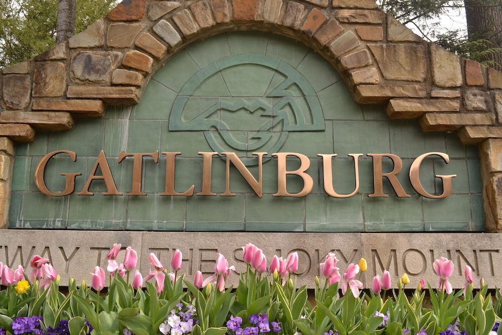 Gatlinburg sign with colorful spring flowers